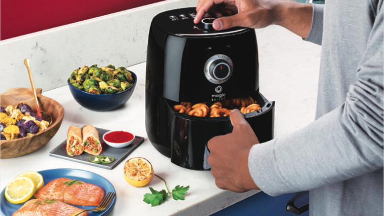 Magic Bullet Air Fryer on counter with food