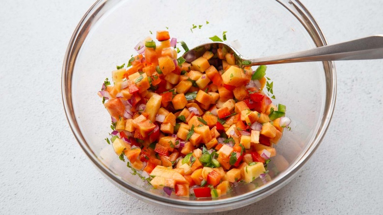 peach salsa in a glass bowl