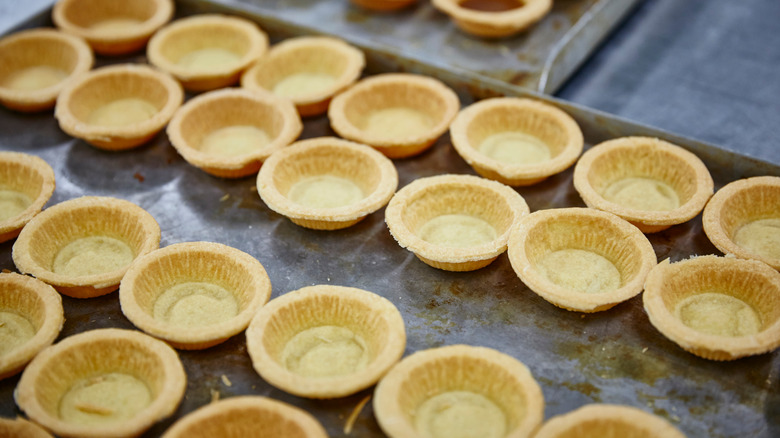 tray of empty pie crusts