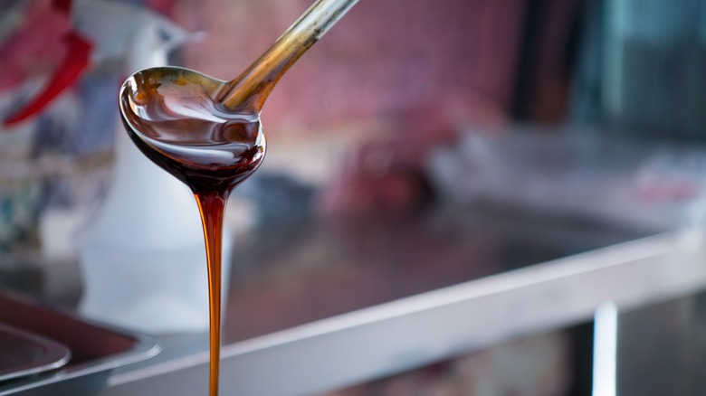 ladle pouring sticky maltose syrup