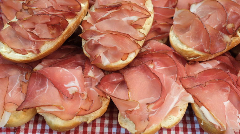 Open faced ham sandwiches at a market