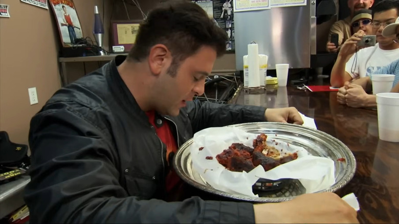 Adam Richman struggling with wings