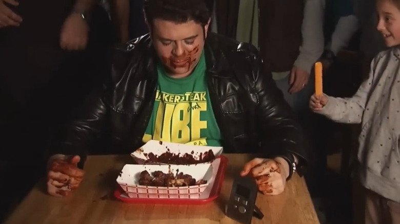 Adam Richman eating hot wings