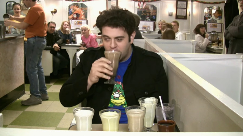 Adam Richman drinking malts in diner