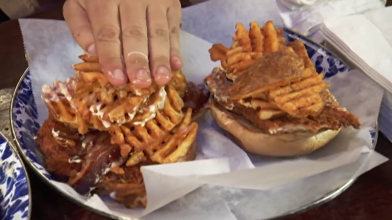 Adam Richman building massive food sandwich