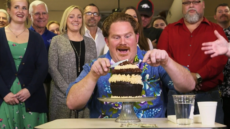 Casey digging into huge cupcake