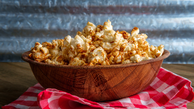 Spicy popcorn in a wooden bowl