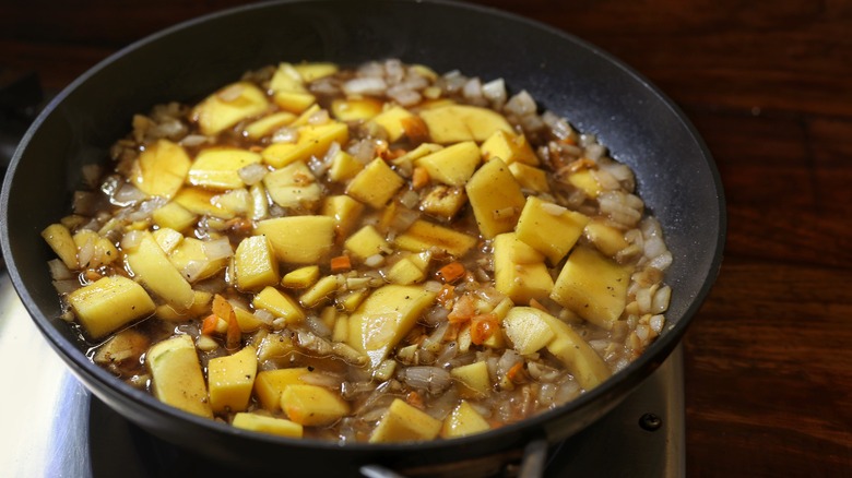 skillet of mango and vegetables