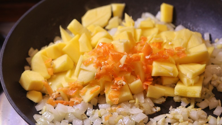 mango and habanero in skillet