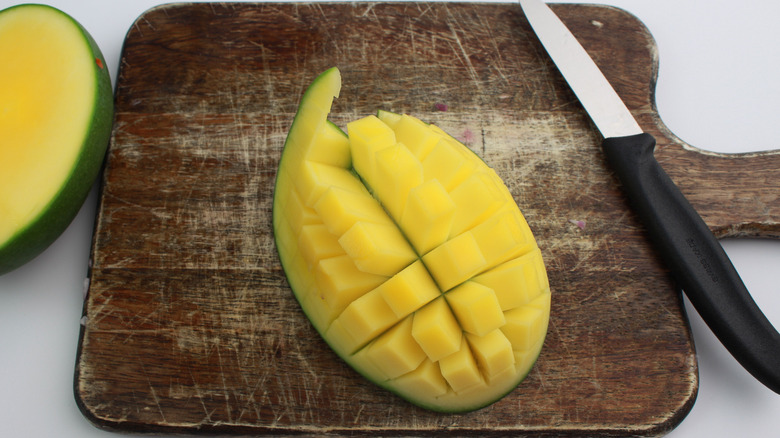  mango on a cutting board