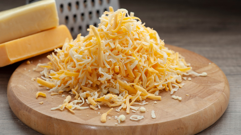 Grated mozzarella and cheddar cheeses