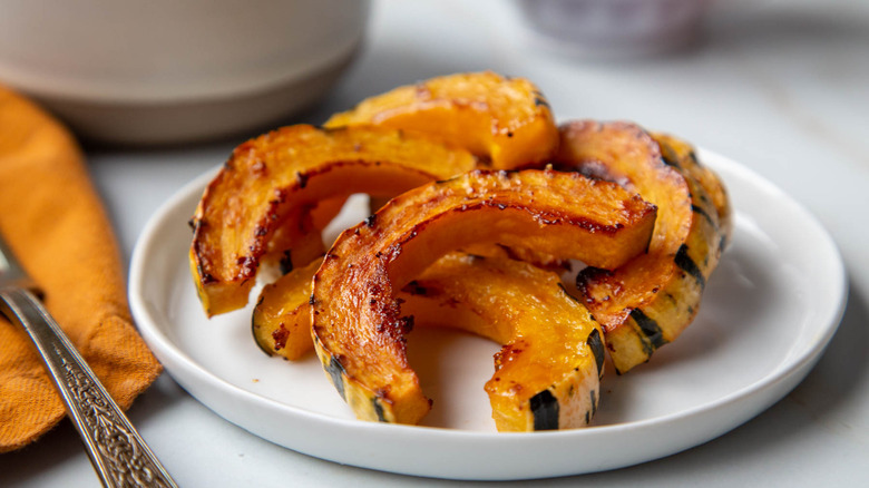 roasted delicata squash on white plate