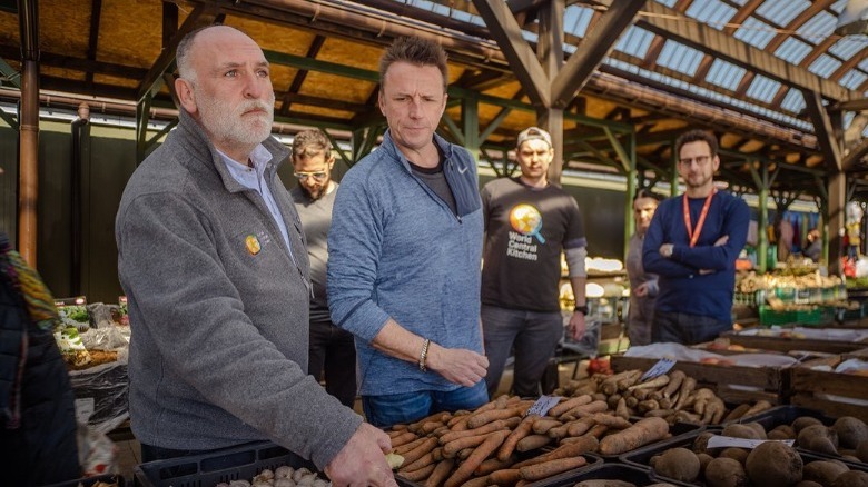 Marc Murphy standing with World Central Kitchen volunteers 