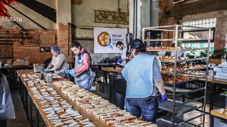 Several volunteers preparing sandwiches in Lviv