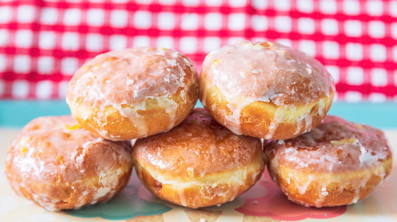 A stack of glazed paczki