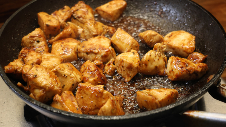 skillet of balsamic-glazed chicken breast pieces