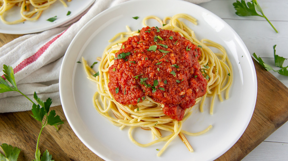 spaghetti presented with marinara sauce