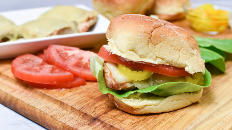 assembling marinated grilled chicken thigh sandwiches