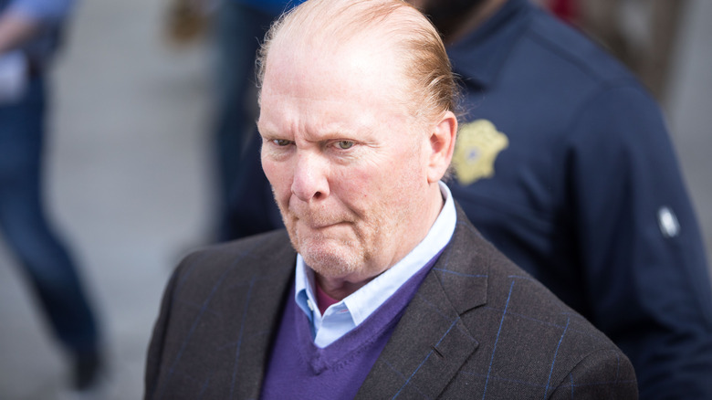 Mario Batali in a gray jacket