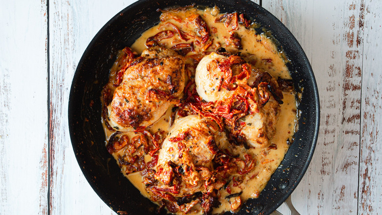 chicken with sauce in pan