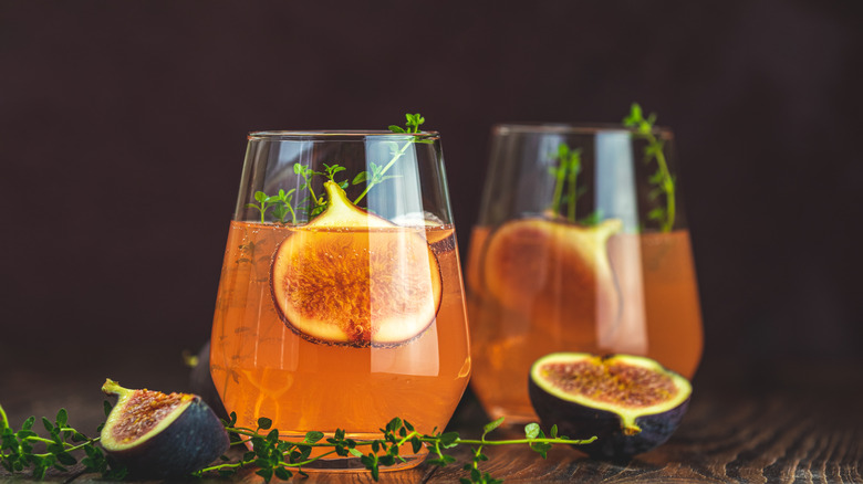 Cocktails in stemless glasses on wooden table