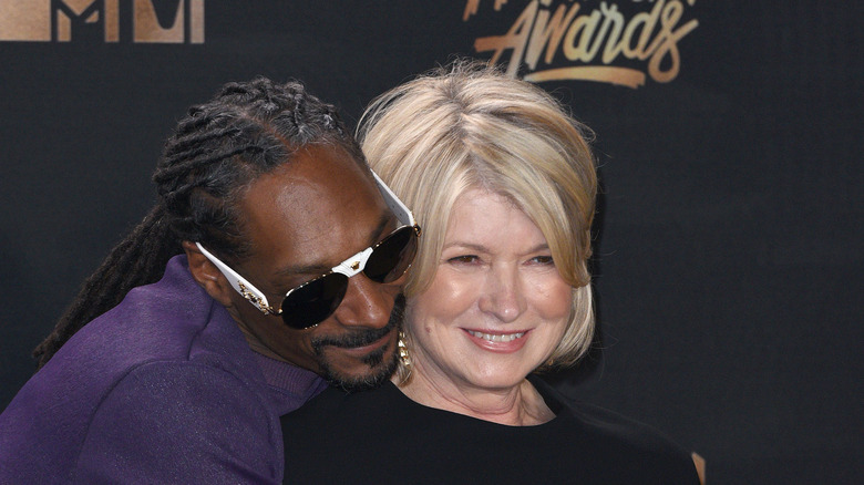 Snoop Dogg hugging Martha Stewart from behind