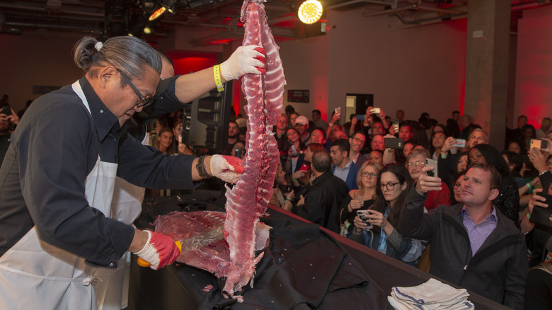 Chef Morimoto butchers fresh fish