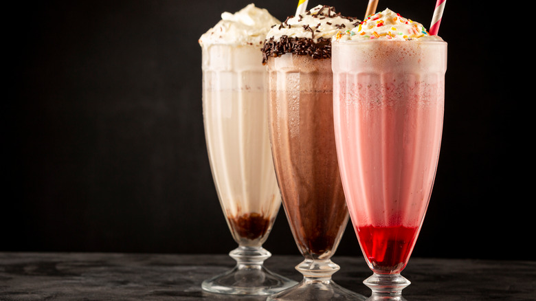 fancy milkshakes on black background