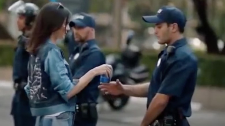 Kendall Jenner hands cop Pepsi