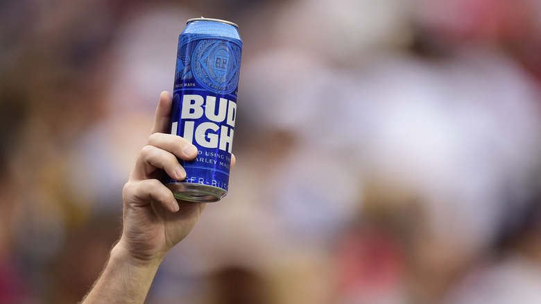 Bud Light can being held
