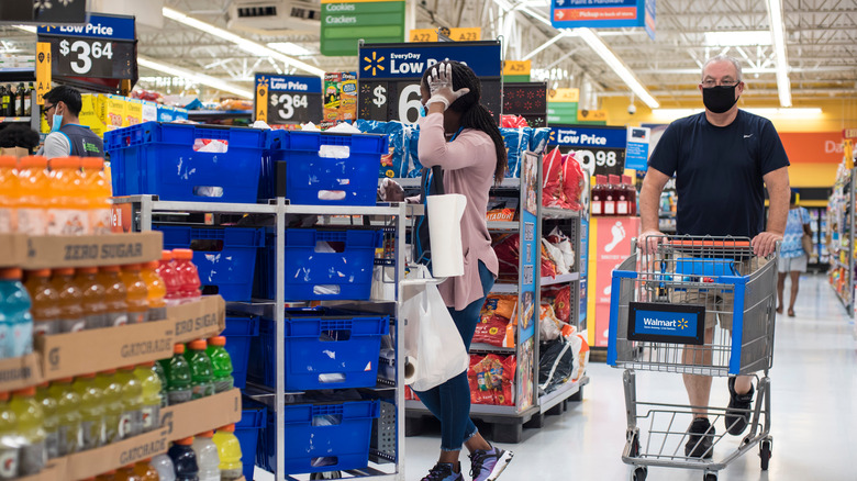 people shopping inside Walmart