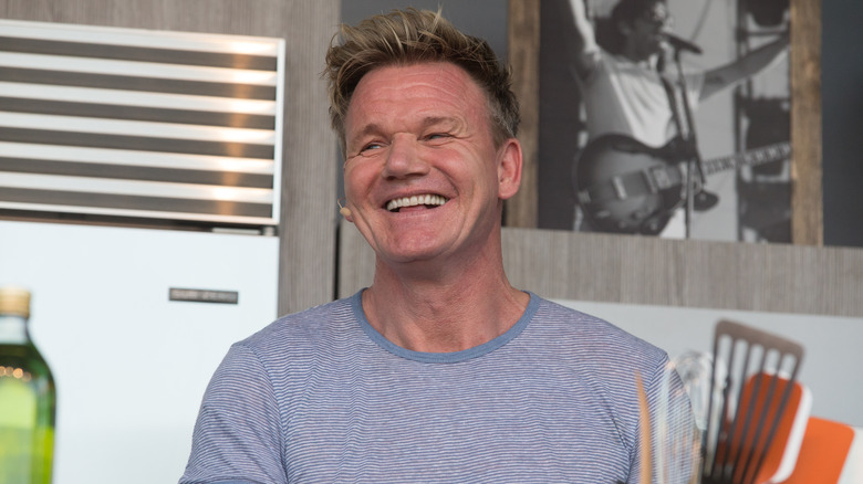 Gordon Ramsay smiling in a kitchen setting