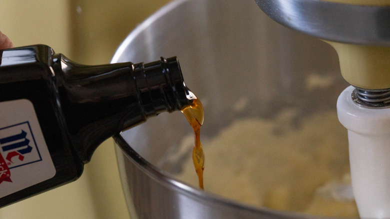 pouring vanilla into stand mixer