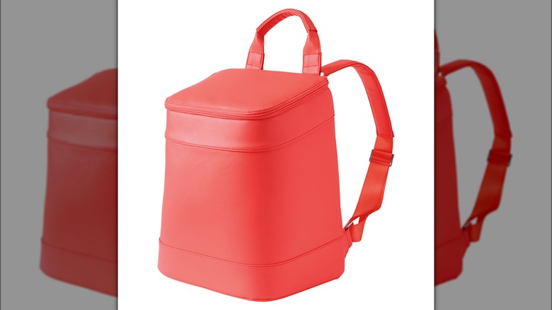 Coral bucket backpack on white background