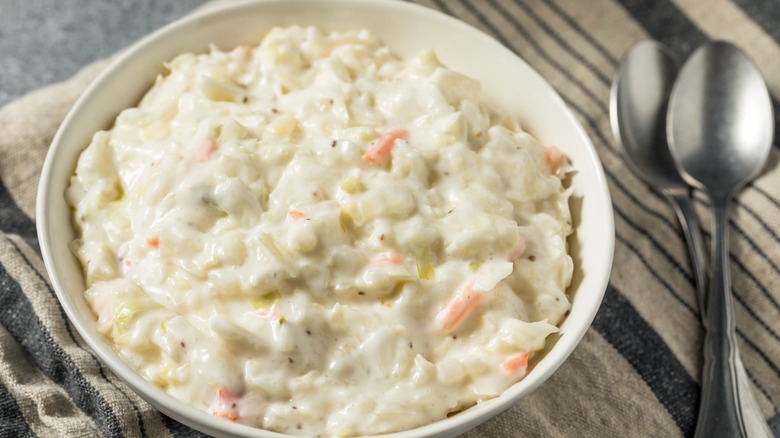 white bowl of creamy coleslaw