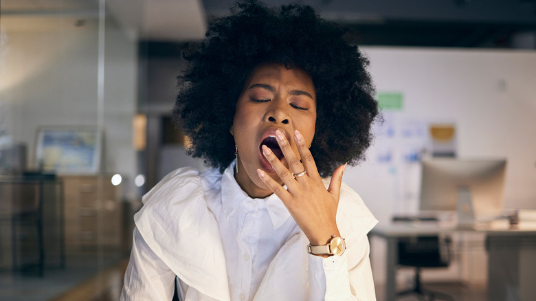 Black woman yawning