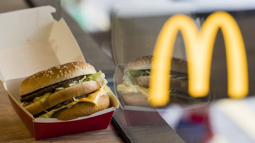 McDonald's burger with the logo in the background