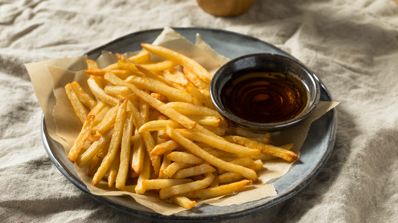 vinegar and fries on plate