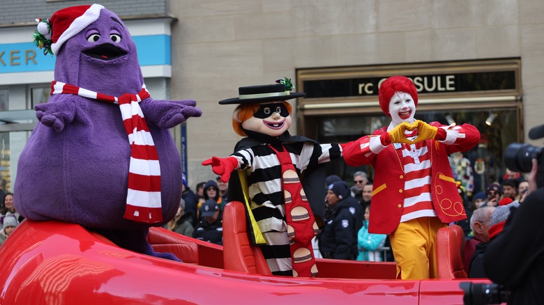 McDonald's mascots Grimace, Hamburglar, and Ronald McDonald in a holiday parade