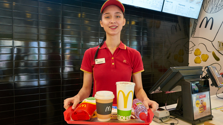 McDonald's worker holding tray