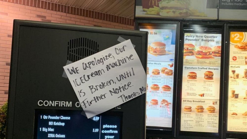 Handwritten sign at McDonald's drive thru: ice cream machine broken