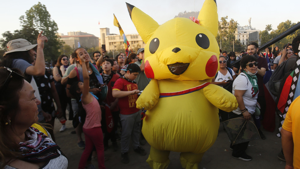 Pikachu with adoring crowd