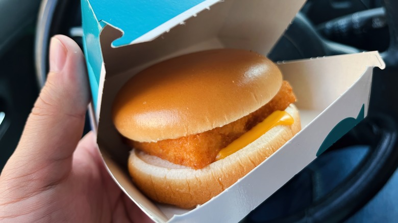 Person holding a Filet-O-Fish in a box