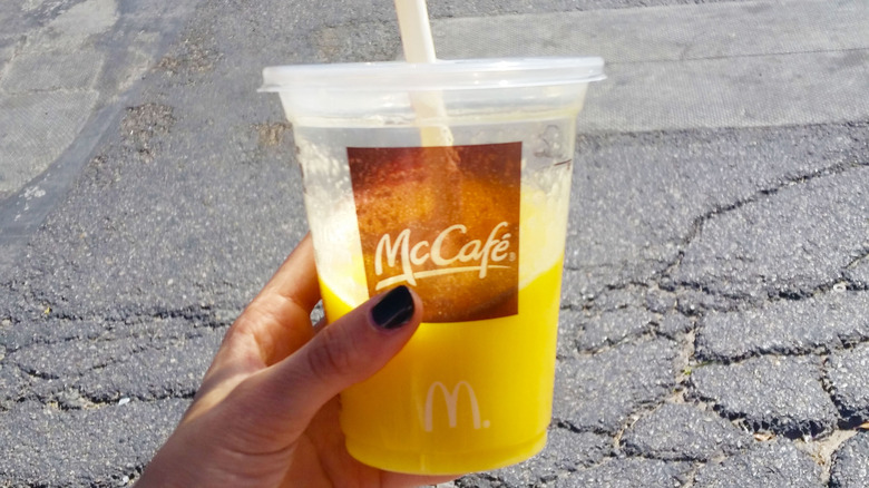 Person holding a McDonald's fruit smoothie