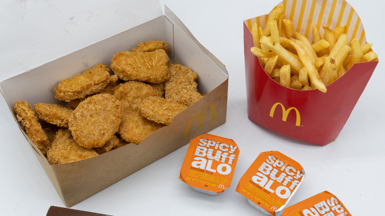 McDonald's chicken nuggets, fries, and spicy buffalo sauce