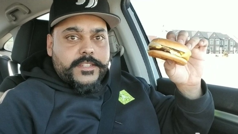 Man holding small Big Mac