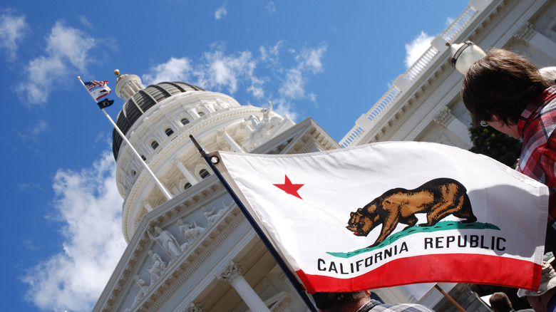 California capitol building and state flag