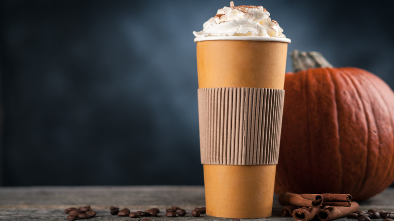 pumpkin spice latte beside pumpkin