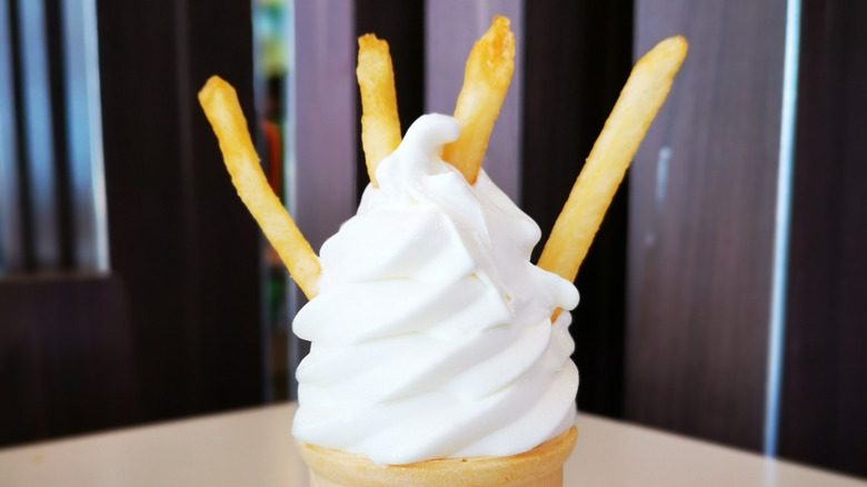 french fries stuck in a vanilla soft serve ice cream cone