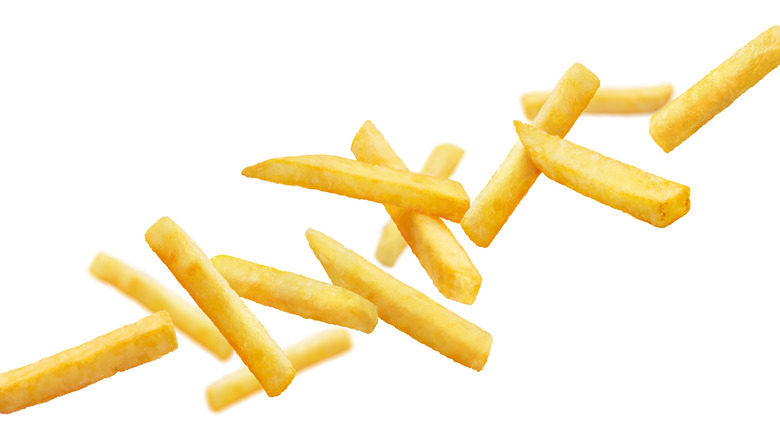 artful french fries on white background